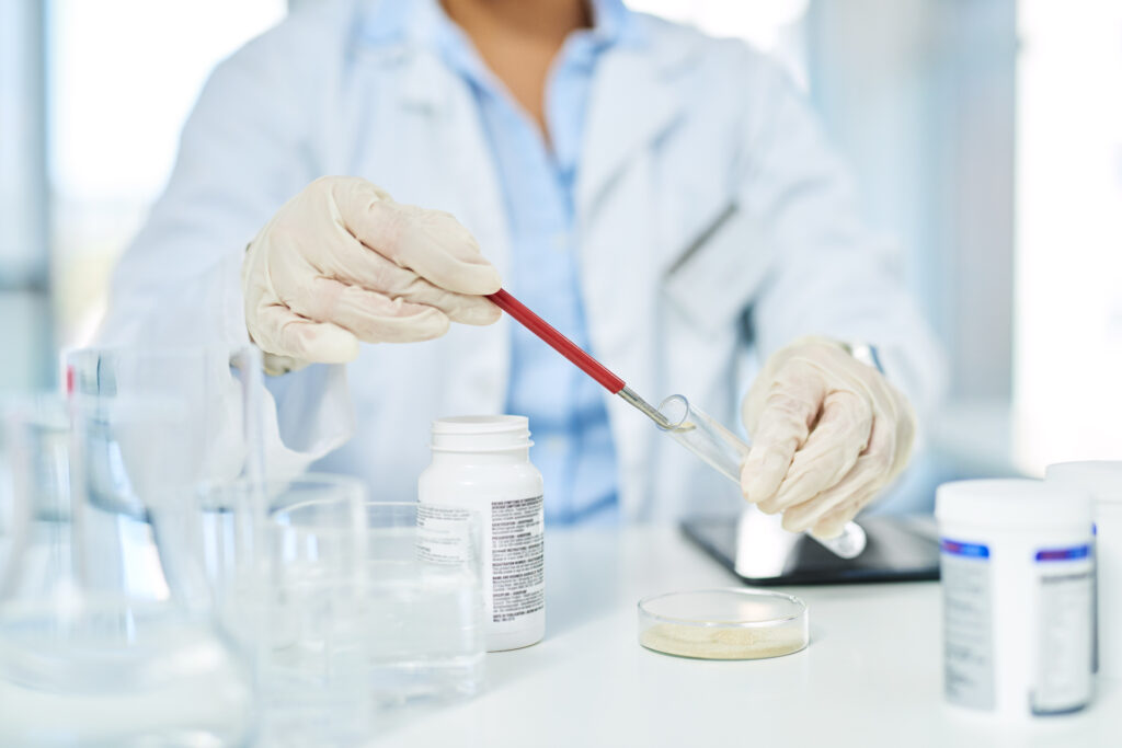 Saving samples to help discover a cure. closeup shot of an unrecognizable scientist working in a lab.