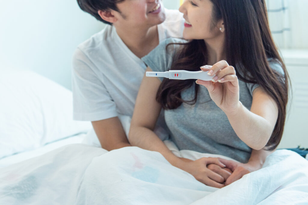 Young happy asian couple with encourage and hug together with pr