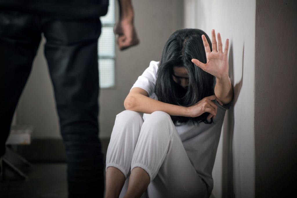 Scared woman because male clenched his hand